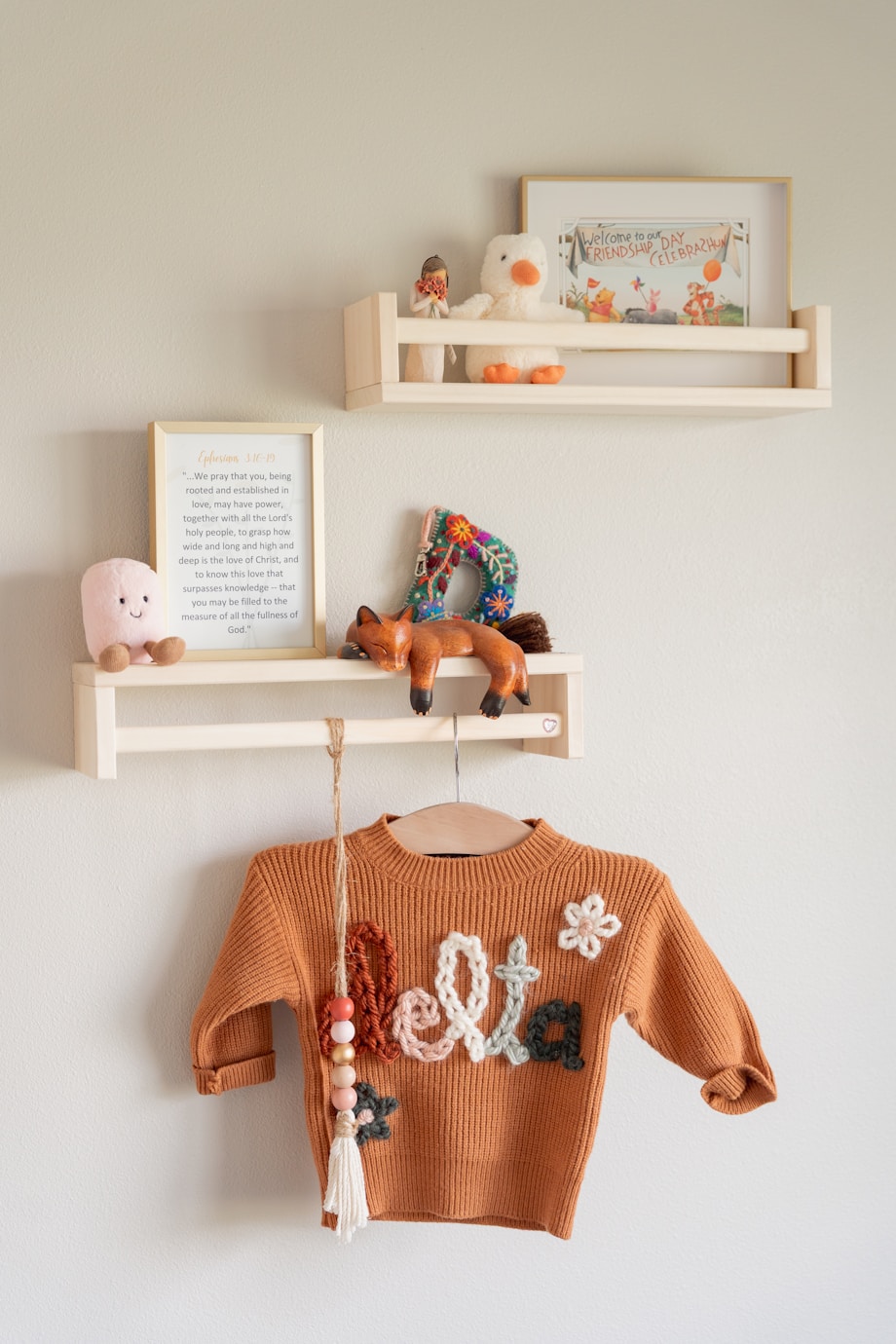 Cozy Canadian nursery with crib, shelves, and warm decor